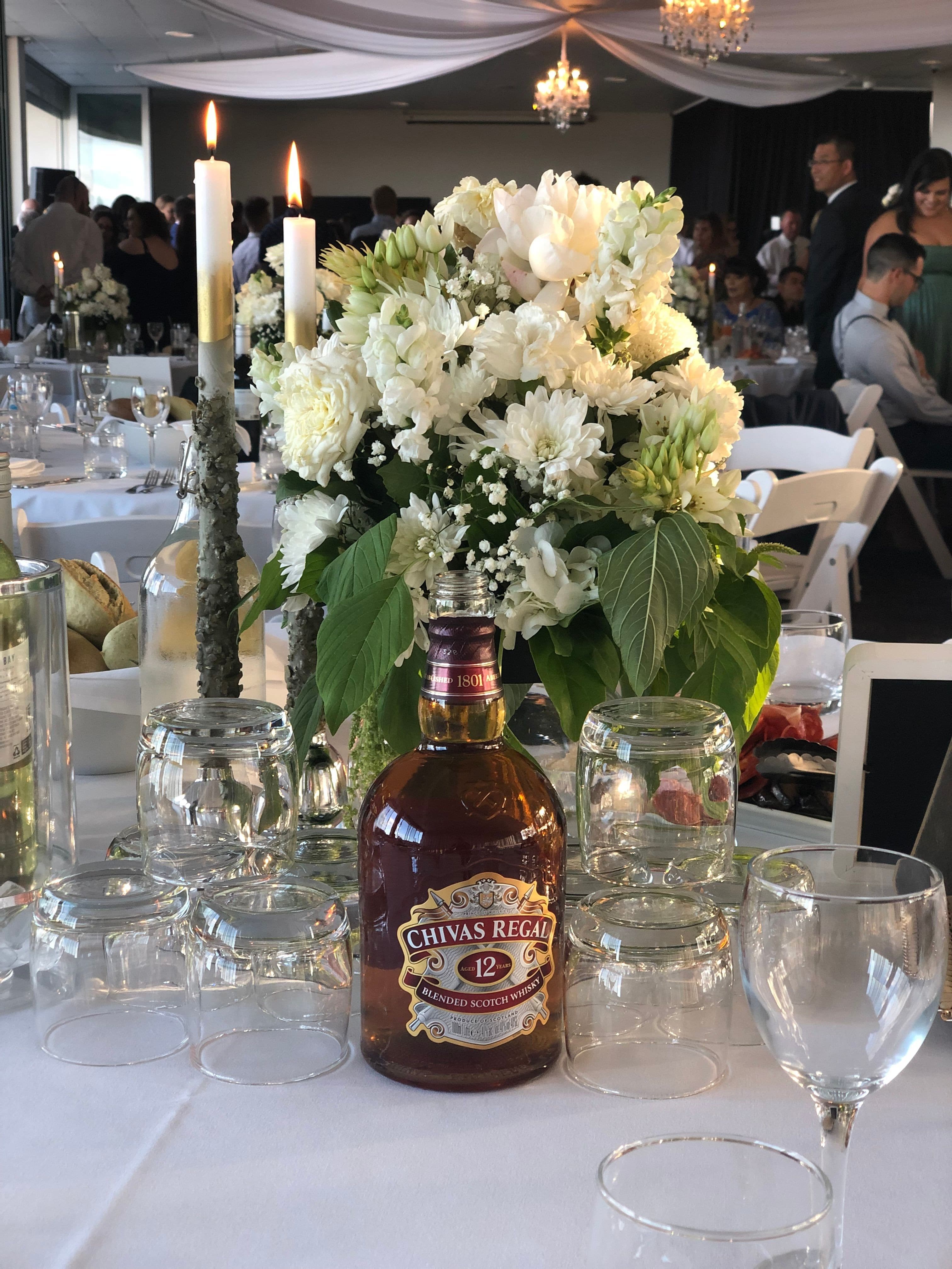 Planned Celebrations with a glass of Whiskey at our Elegant Beach Wedding Reception