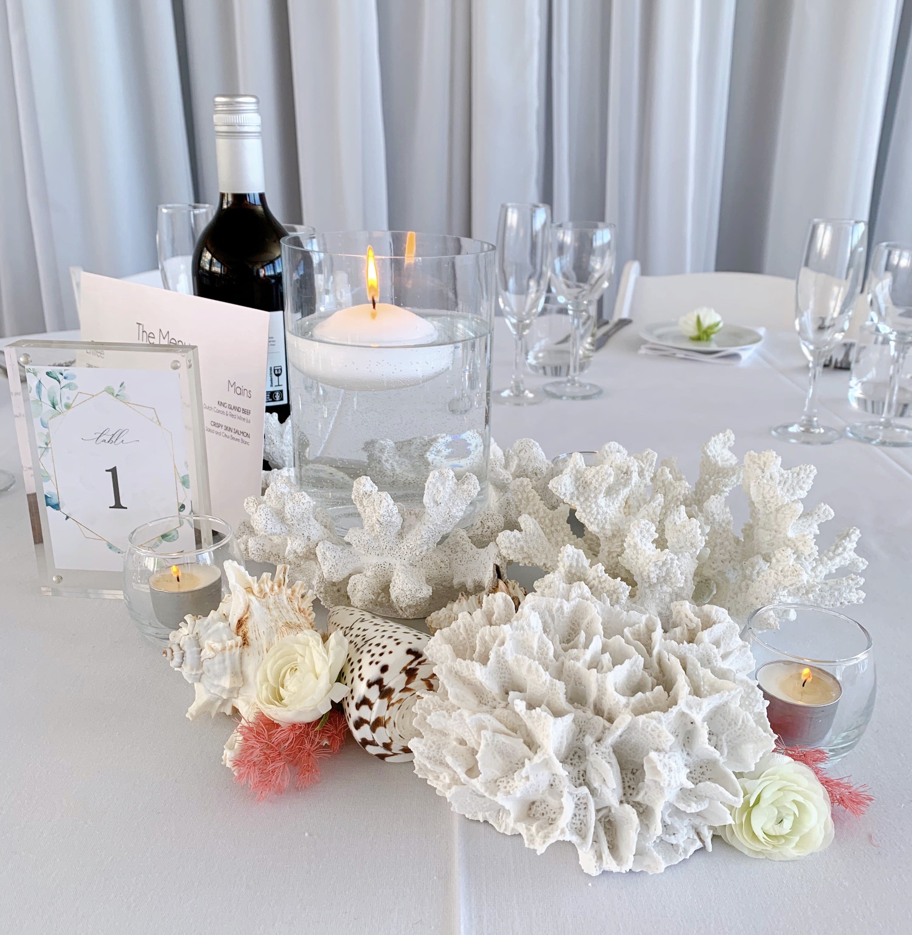 The Beach brought to the reception with our coral features and candles to match - Horizons